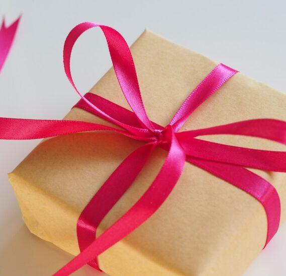 gift box in gold with pink bow